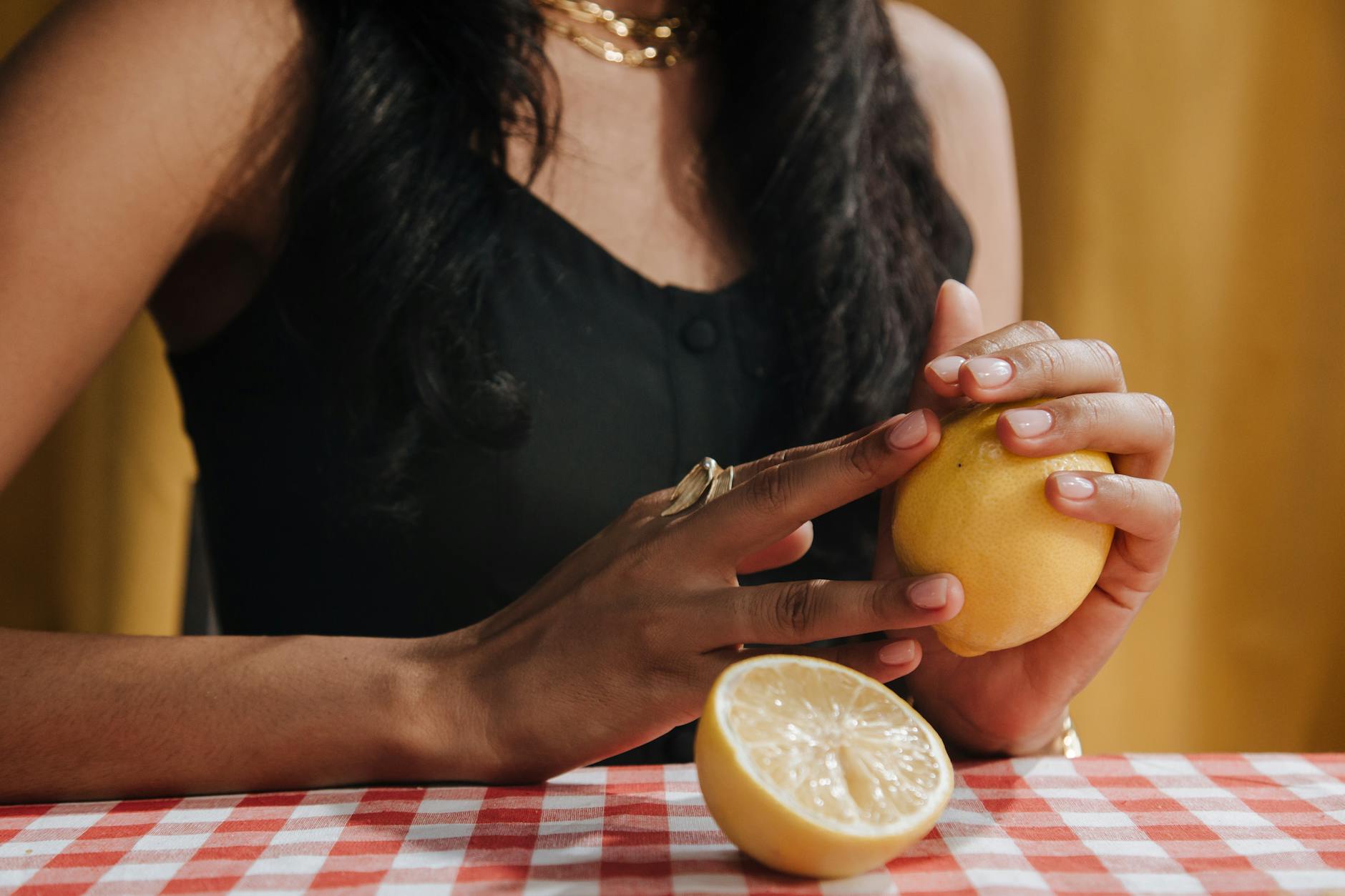 Two fresh lemons on a minimalist white background, representing the bright, targeted approach to restoring sensation